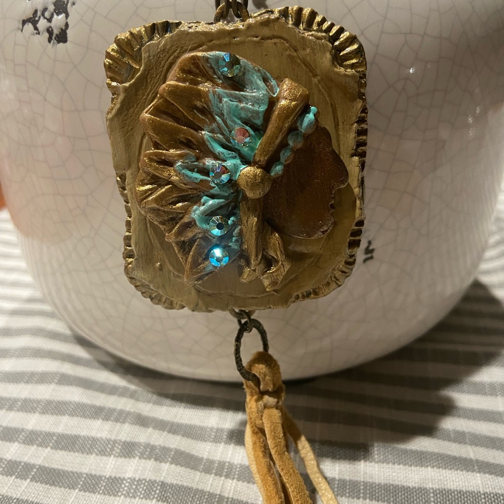 Same Spirit molded Indian head pendant with crystals and leather tassel